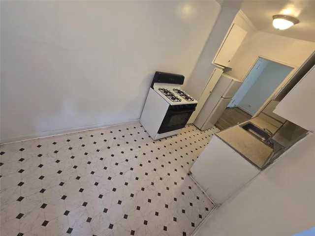 a bedroom with a bed and cabinets