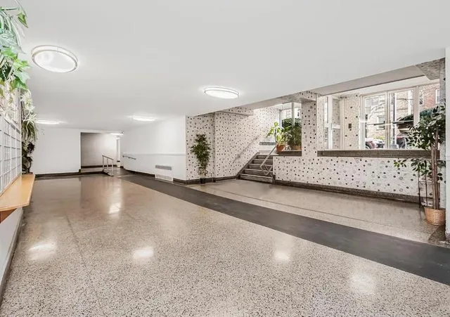 a view of room with window and hardwood floor