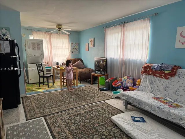 a room with gym equipment and a window