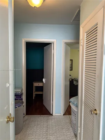 a view of a bedroom from a hallway