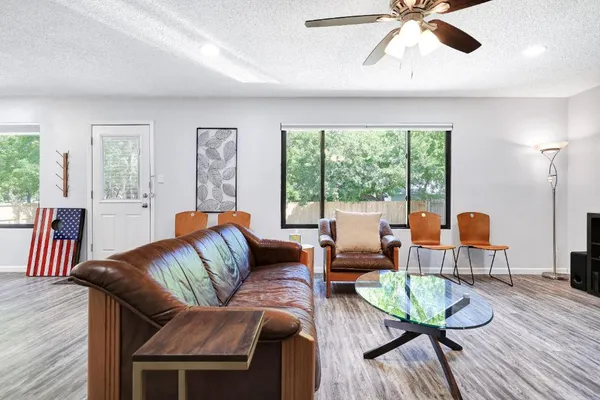 a living room with furniture and a large window