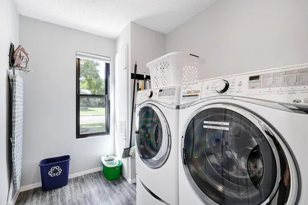 a utility room with dryer and washer