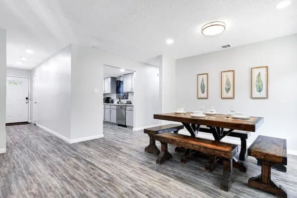a view of a livingroom with furniture and wooden floor