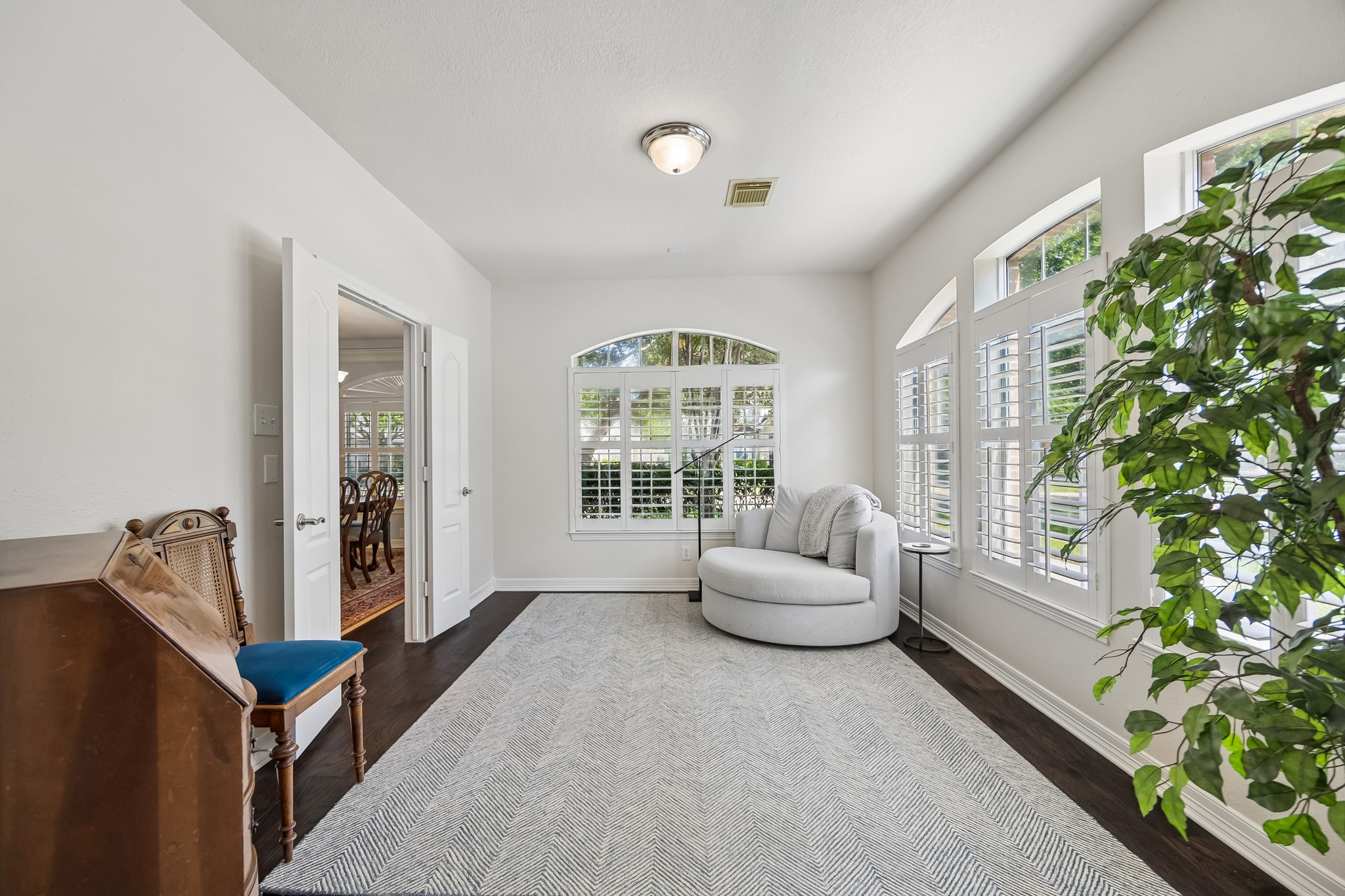 5718 Brennan Ridge Lane Katy, TX 77450 - Photo 13 of 42 A SPACE THAT ADAPTS TO YOUR LIFE: Lined with windows and plantation shutters, this flexible room is perfectly suited for a home office, playroom, reading retreat, or bright sun-filled sitting area.