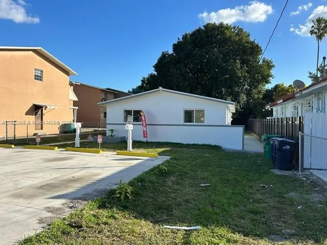 a view of room with wooden floor