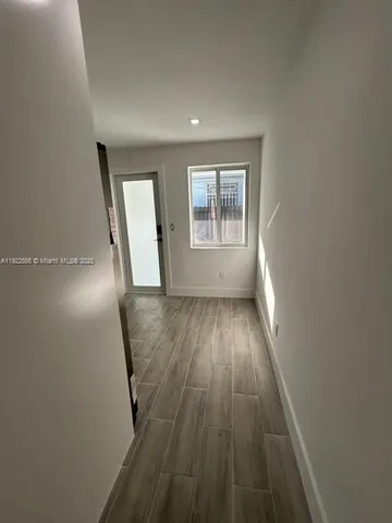 a kitchen with wooden cabinets and a stainless steel appliances