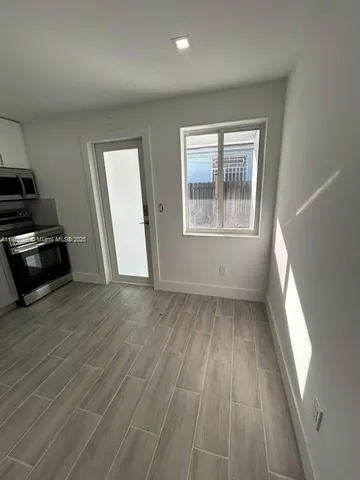 a kitchen with sink and cabinets