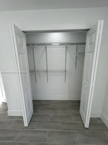 a bathroom with a shower sink and mirror