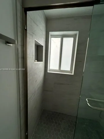 a view of a backyard with large trees