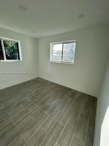 a view of a backyard of the house