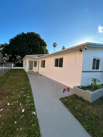 a view of a house with a street