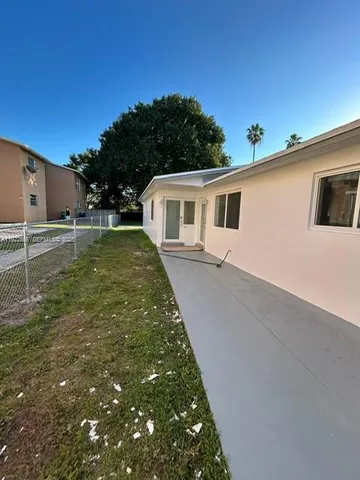 a view of a back yard of the house