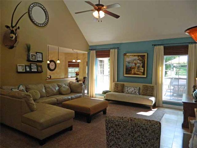835 Ridgetop Drive Mount Juliet, TN 37122 - Photo 10 of 20 Greatroom: 21 x 16 This room features a vaulted ceiling, warm color décor, gas burning fireplace with decorative wood mantle, marble surrounds & mirror with detailed trim, travertine tile flooring, tube sky lights and opens to the Foyer & Kitchen