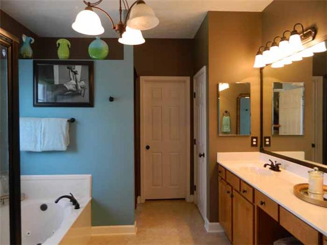 835 Ridgetop Drive Mount Juliet, TN 37122 - Photo 17 of 20 spacious private bathroom with his & her sink area in the double bowl vanity that also features a knee cut out for a makeup/dressing area, large garden tub and separate shower, large walk-in closet and large linen closet