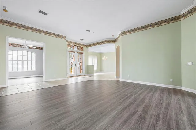 a view of an entryway with wooden floor