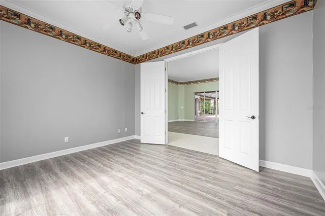 a spacious bathroom with a granite countertop tub sink and mirror