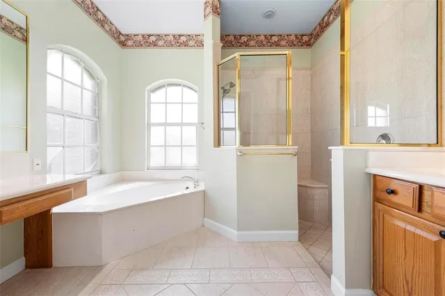 a very nice looking room with a window and a chandelier