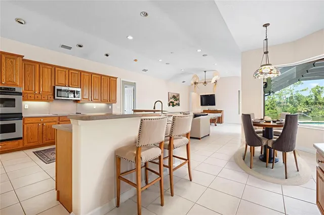 a bathroom with a granite countertop sink a toilet and a mirror