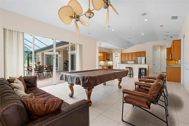 a spacious bedroom with a large bed and a couch