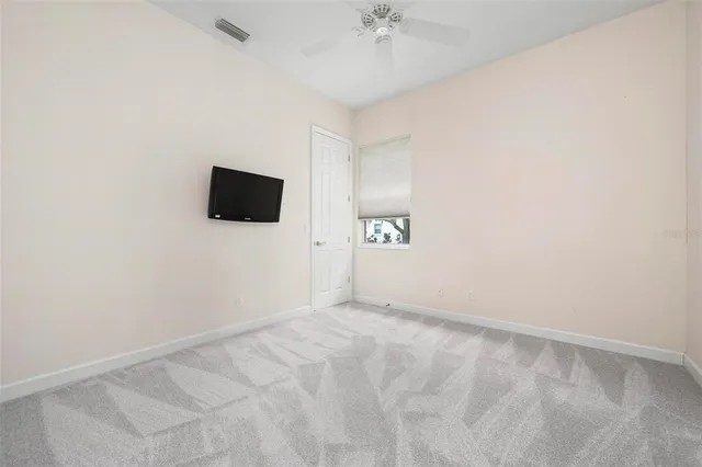 an aerial view of a house with a lake view