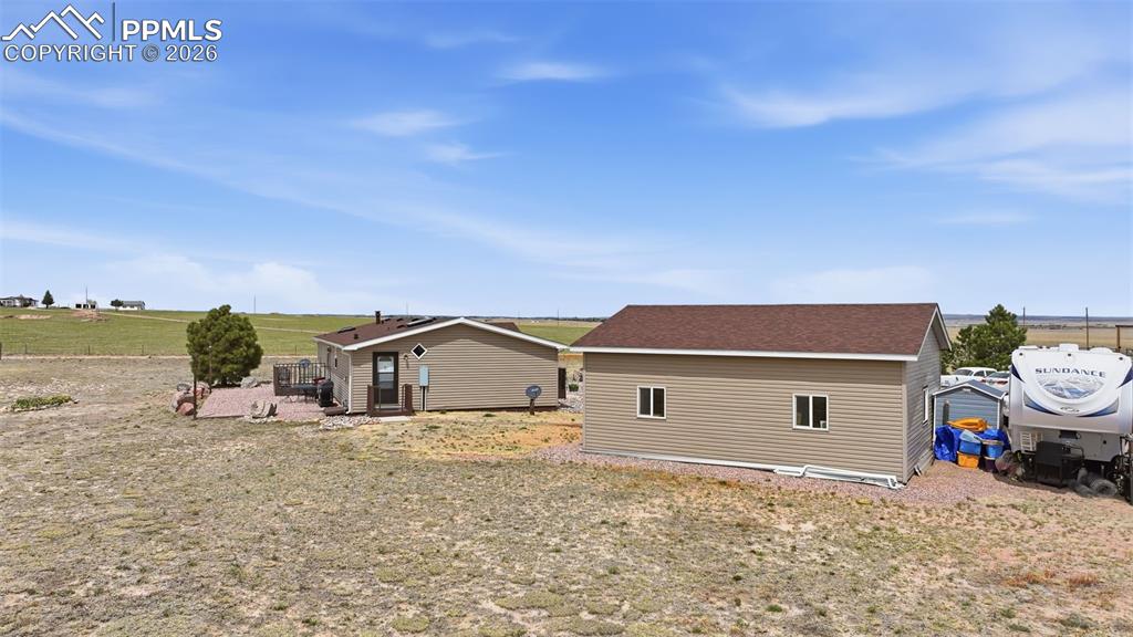 20985 McDaniels Road Calhan, CO 80808 - Photo 9 of 41 a front view of a house with a yard