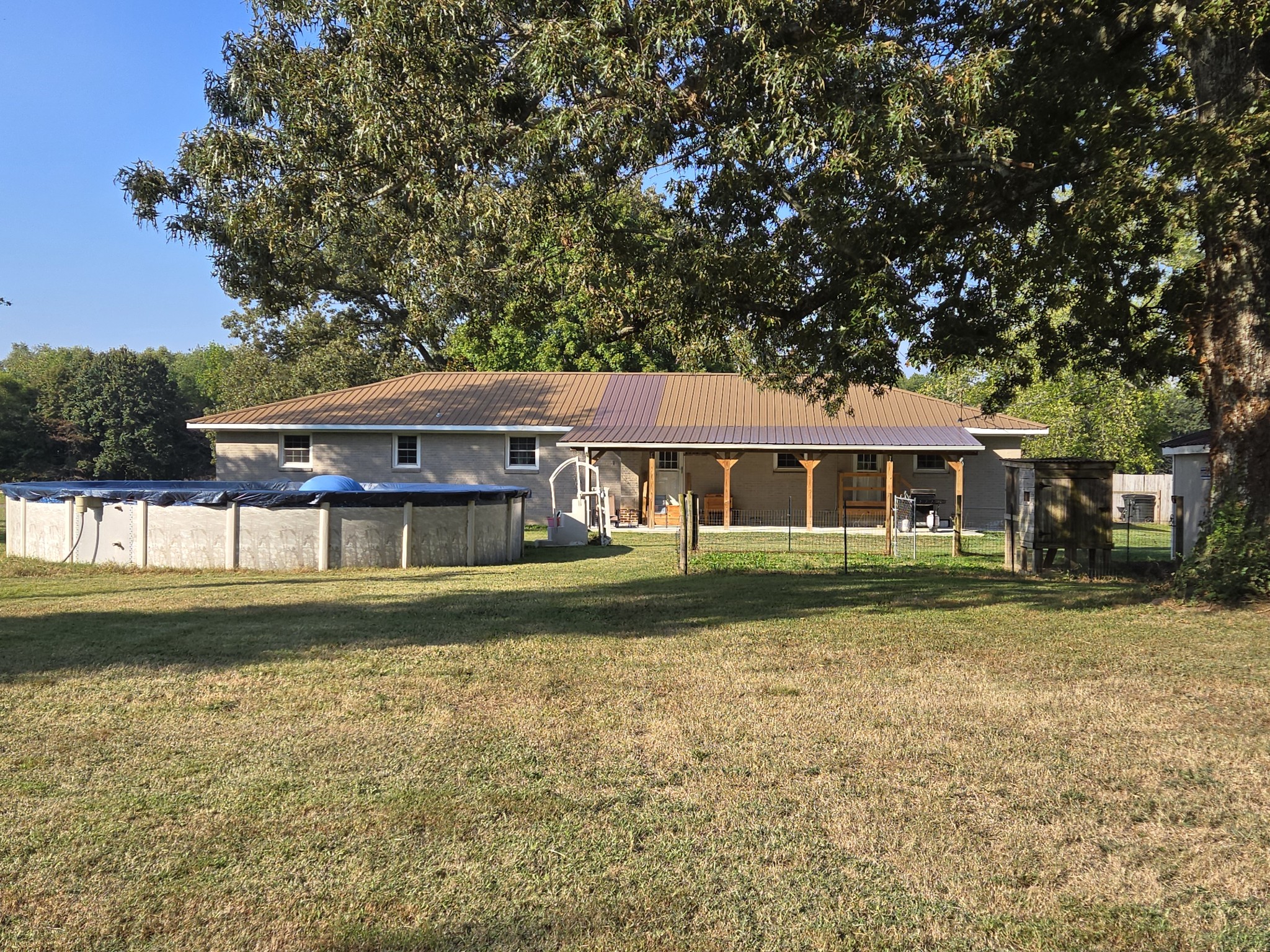 10831 Old Tullahoma Road Tullahoma, TN 37388 - Photo 19 of 25 a front view of a house with a yard table and chairs