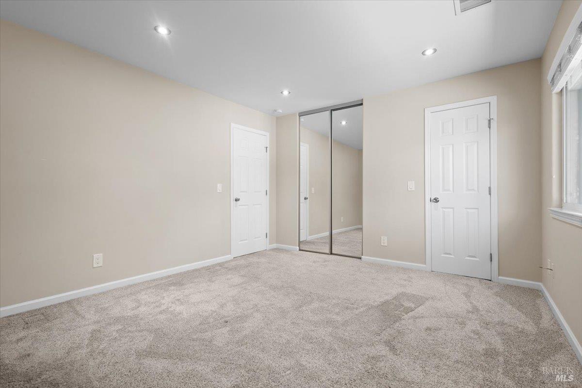 303 Algiers Court Santa Rosa, CA 95409 - Photo 15 of 27 Also enjoy dual closets in the primary bedroom: one mirrored and one walk-in.