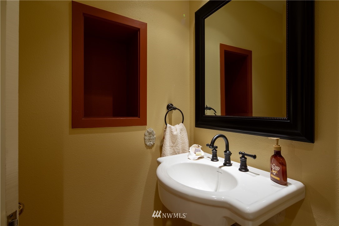 220 Sea Pines Road Bellingham, WA 98229 - Photo 21 of 40 a bathroom with a sink and a mirror