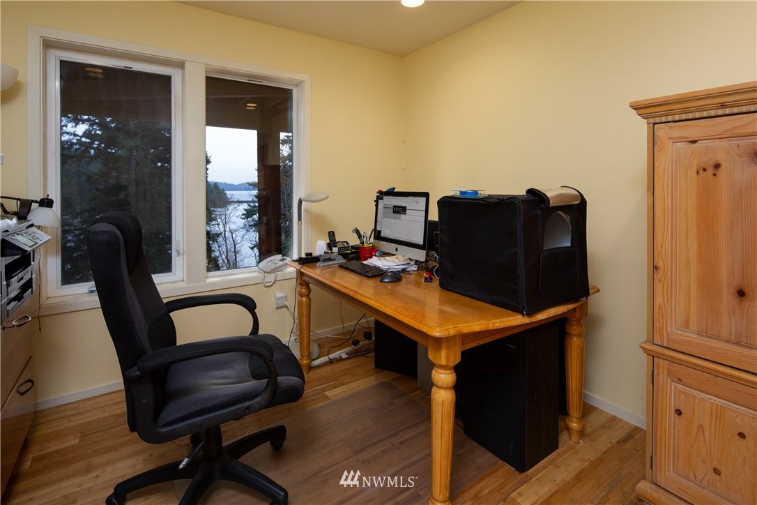 220 Sea Pines Road Bellingham, WA 98229 - Photo 23 of 40 a room with furniture and wooden floor