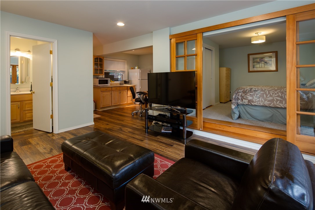 220 Sea Pines Road Bellingham, WA 98229 - Photo 25 of 40 a living room with furniture and a flat screen tv