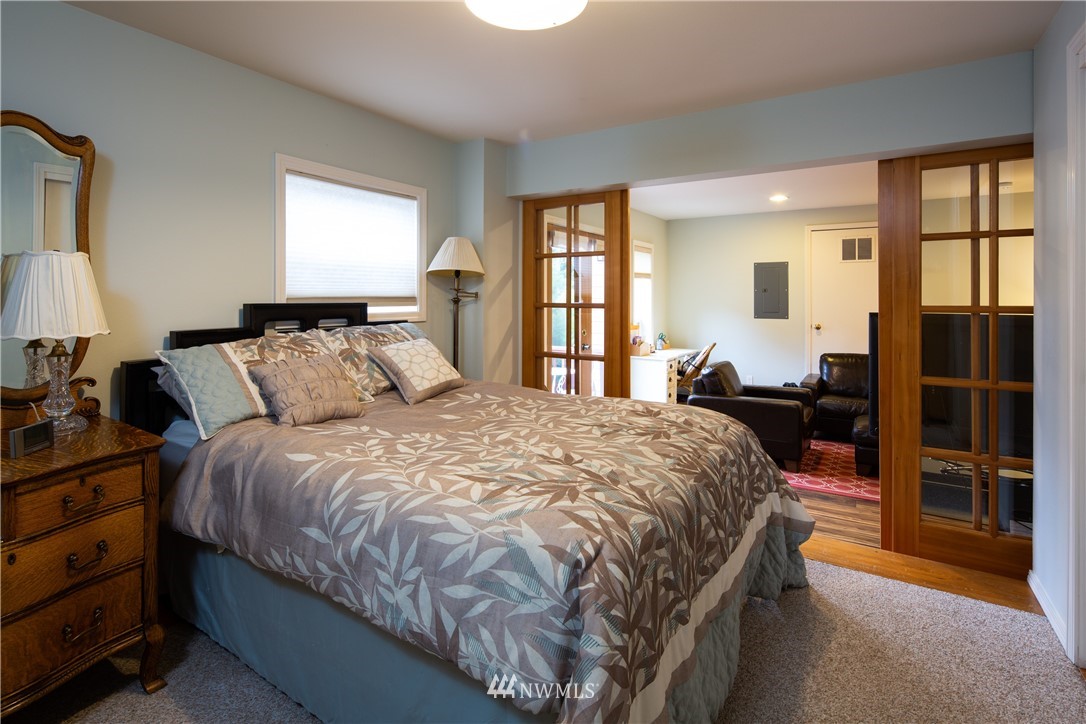 220 Sea Pines Road Bellingham, WA 98229 - Photo 26 of 40 a bed sitting in a bedroom next to a window