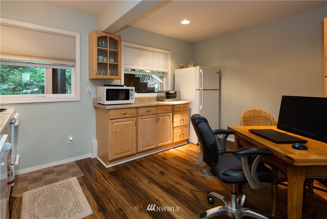 220 Sea Pines Road Bellingham, WA 98229 - Photo 27 of 40 a kitchen with a table and chairs