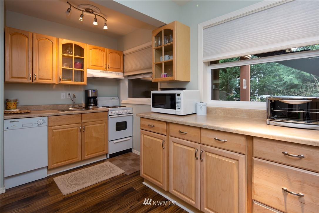 220 Sea Pines Road Bellingham, WA 98229 - Photo 28 of 40 a kitchen with cabinets appliances and a sink