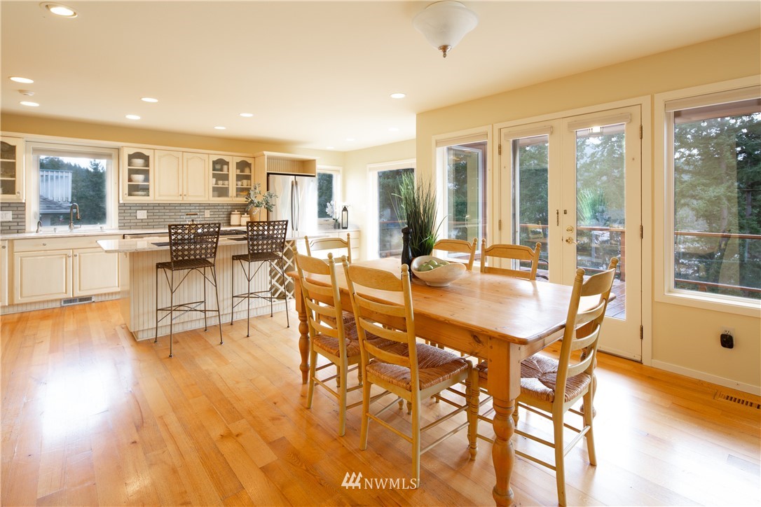 220 Sea Pines Road Bellingham, WA 98229 - Photo 7 of 40 a view of a dining room with furniture and wooden floor