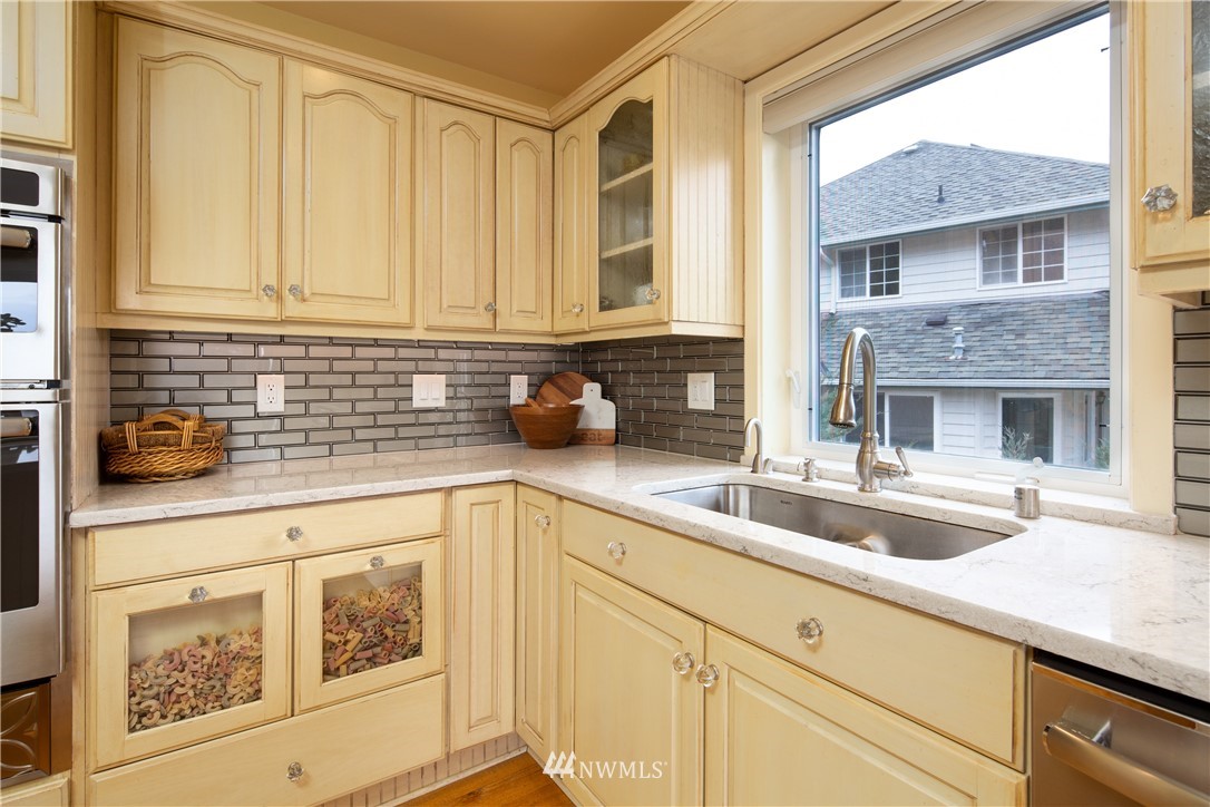 220 Sea Pines Road Bellingham, WA 98229 - Photo 10 of 40 a kitchen with granite countertop a sink and white cabinets