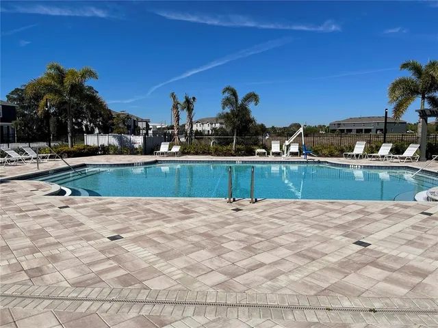 a view of a swimming pool and a chair