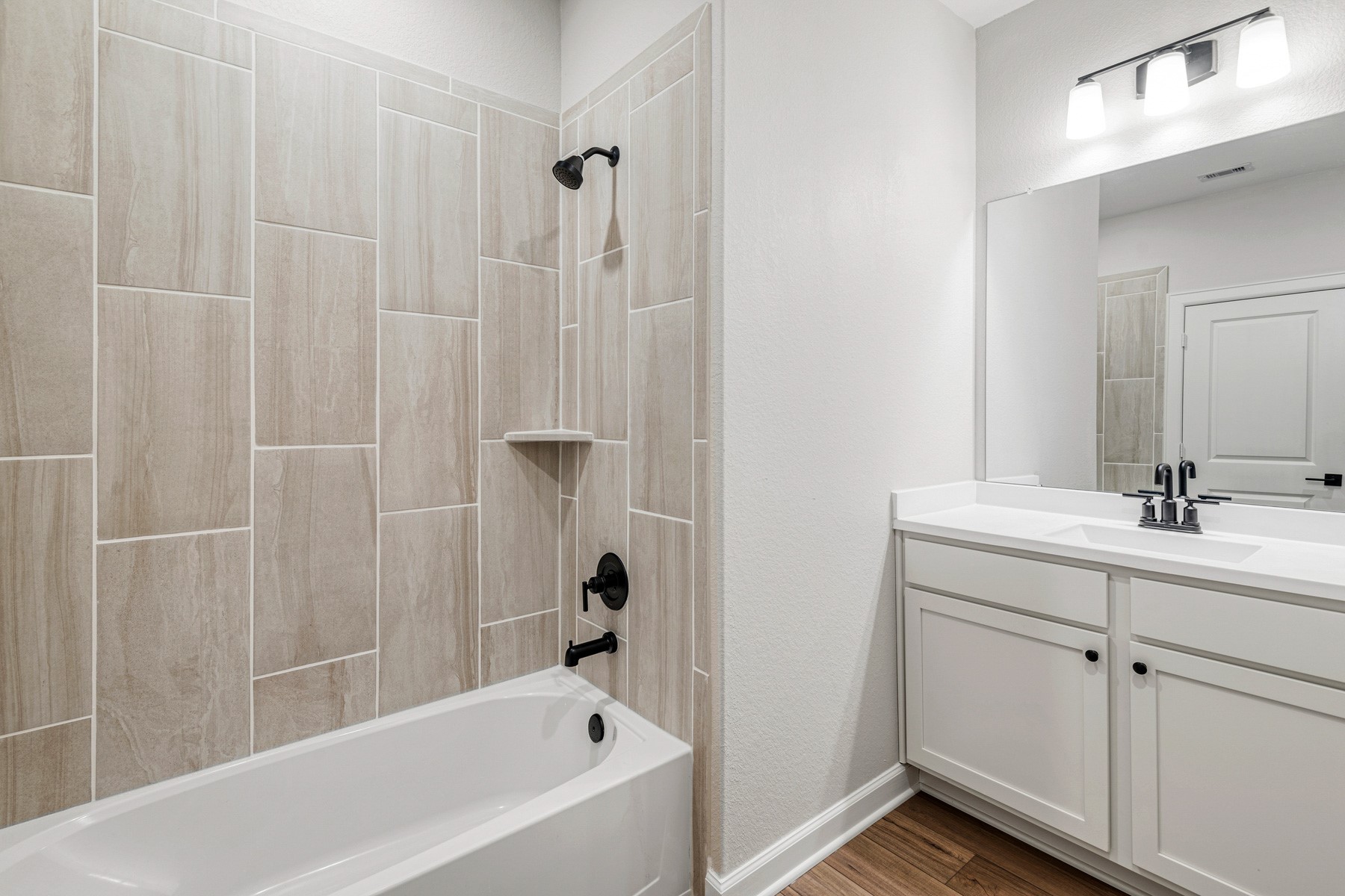 15765 Bayberry Trce Drive Conroe, TX 77303 - Photo 14 of 21 a bathroom with a tub a sink and mirror