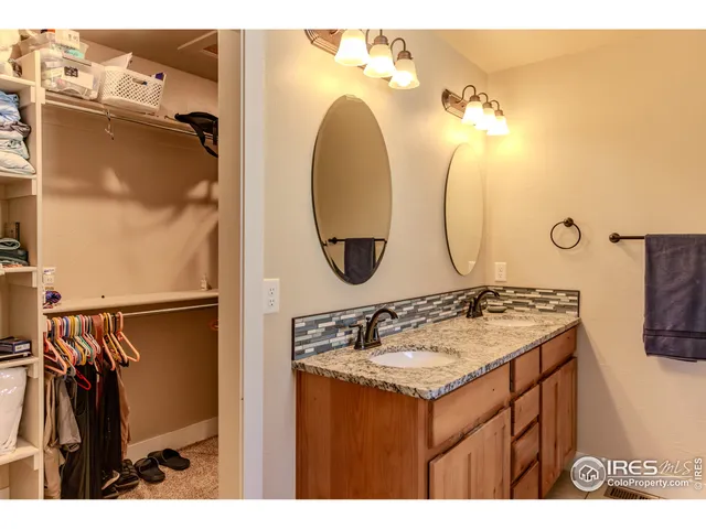 a bathroom with a sink vanity and a mirror
