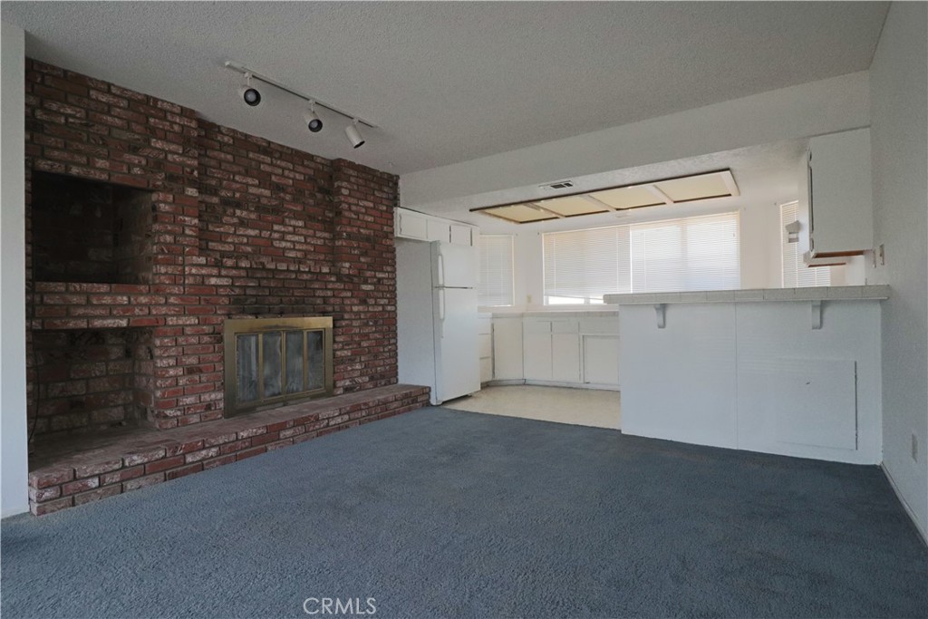 4752 Flying H Road Twentynine Palms, CA 92277 - Photo 29 of 55 a view of empty room with a fireplace