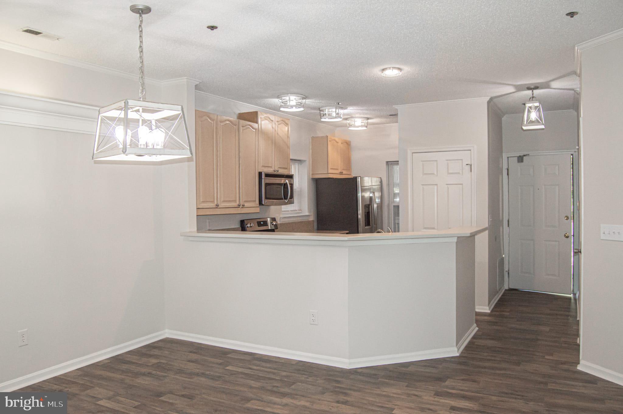 105 Square Rigger Way, Unit 105 Solomons, MD 20688 - Photo 6 of 28 Dining Area