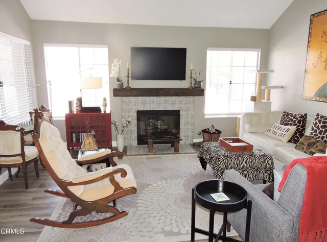 a living room with furniture and a fireplace