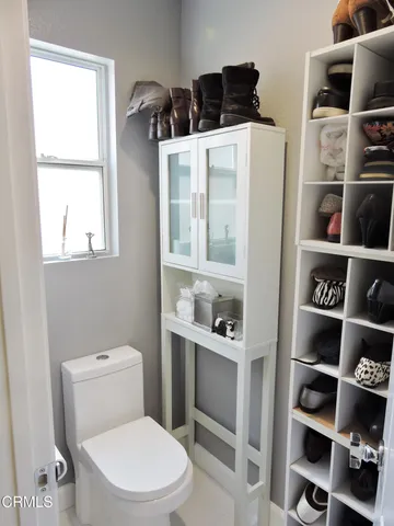 a hallway with a view of living room