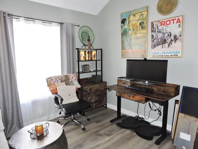 a view of a workspace with furniture and entryway