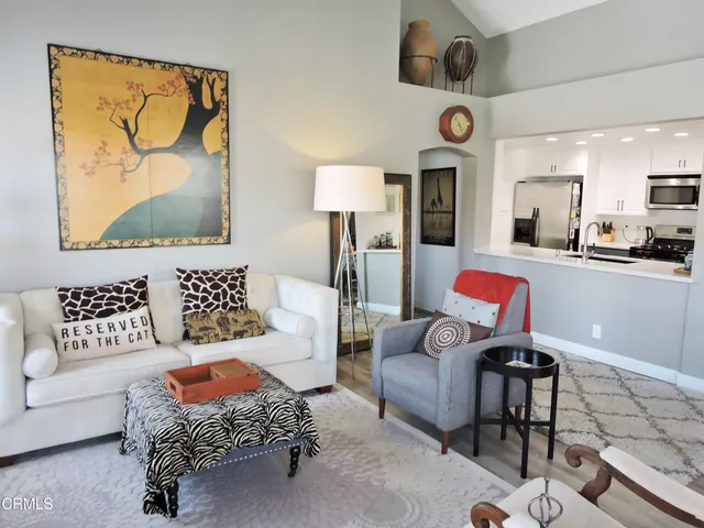 a living room with furniture and a rug