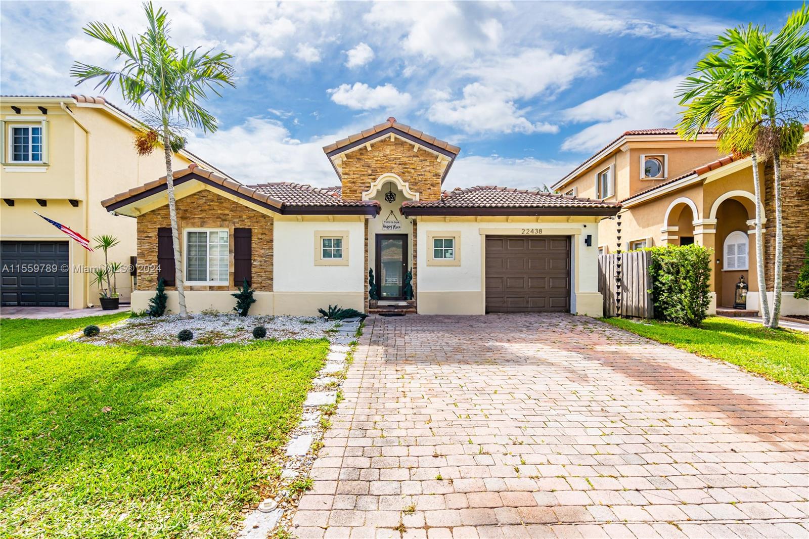 22438 Southwest 94th Path Cutler Bay, FL 33190 - Photo 1 of 38 a front view of a house with swimming pool and porch with furniture