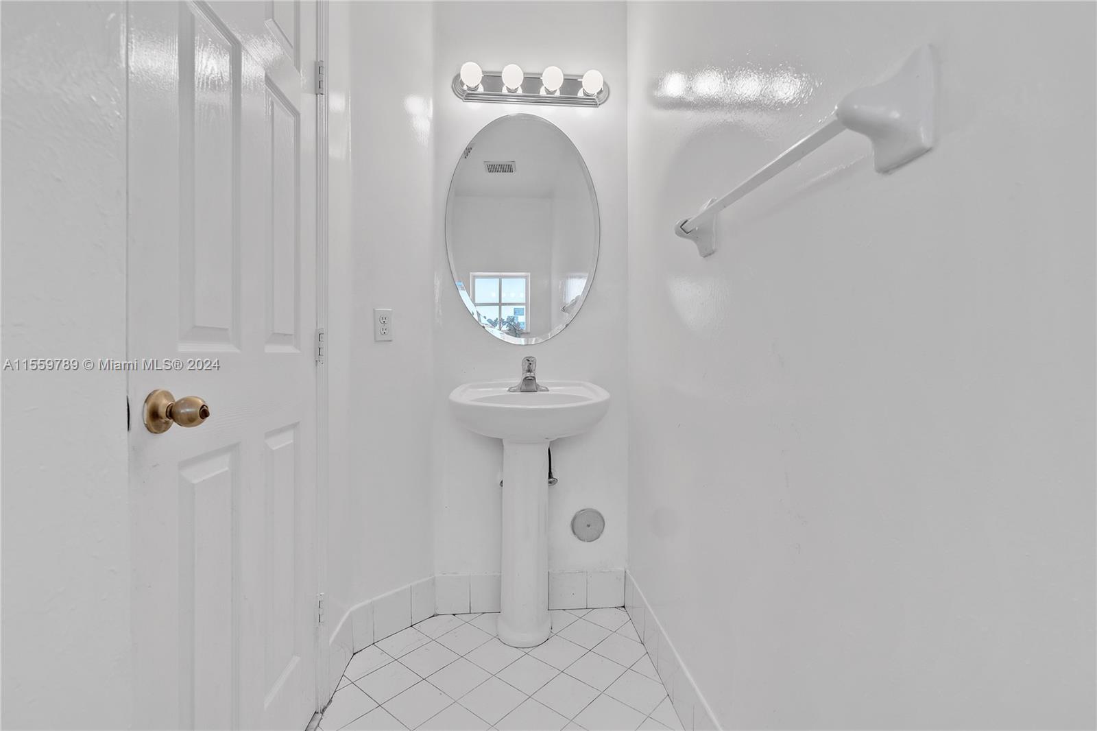 22438 Southwest 94th Path Cutler Bay, FL 33190 - Photo 13 of 38 a bathroom with a sink and a mirror