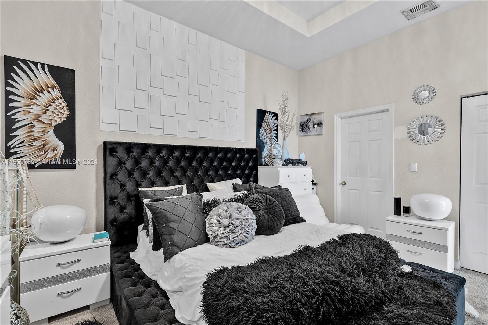 22438 Southwest 94th Path Cutler Bay, FL 33190 - Photo 15 of 38 a bedroom with a bed and window
