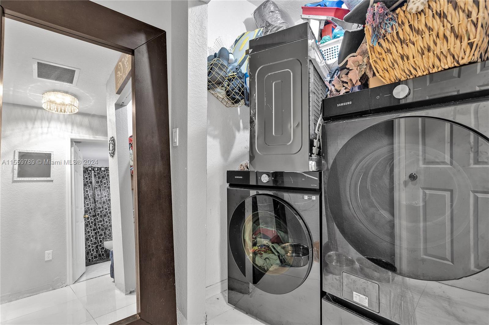 22438 Southwest 94th Path Cutler Bay, FL 33190 - Photo 24 of 38 a view of a living room washer and dryer