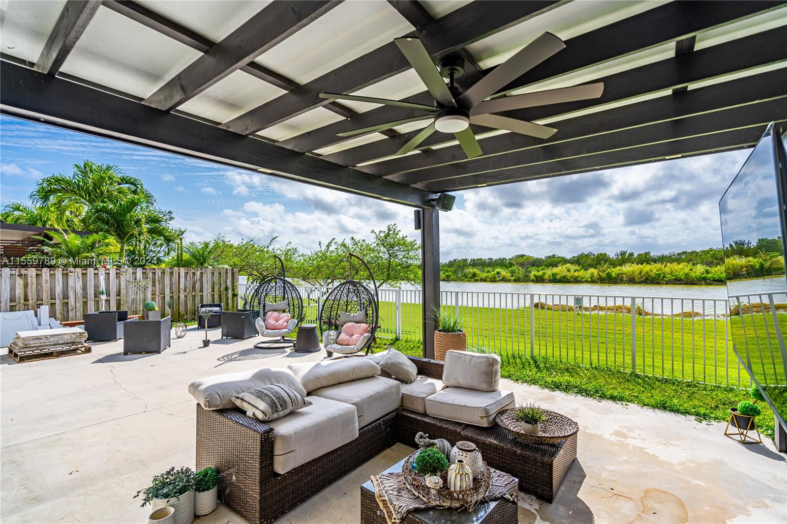 22438 Southwest 94th Path Cutler Bay, FL 33190 - Photo 28 of 38 a outdoor living space with furniture and garden view