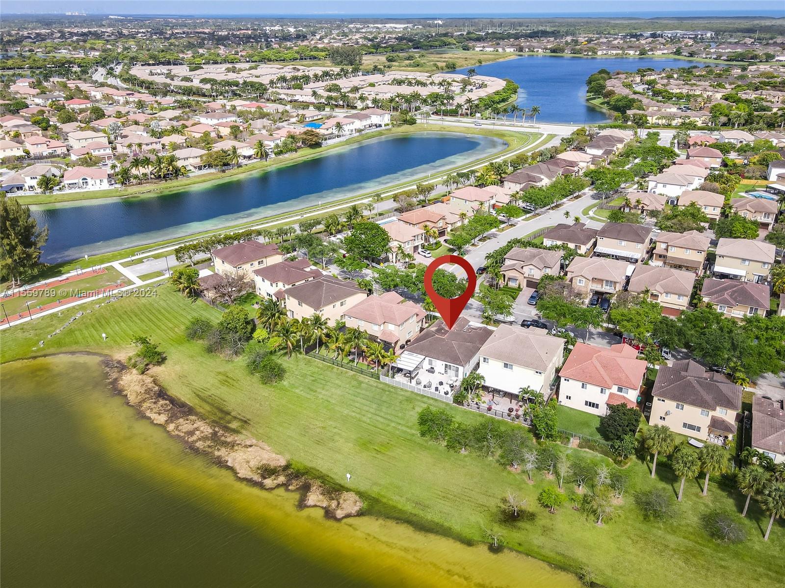 22438 Southwest 94th Path Cutler Bay, FL 33190 - Photo 33 of 38 an aerial view of residential houses with outdoor space
